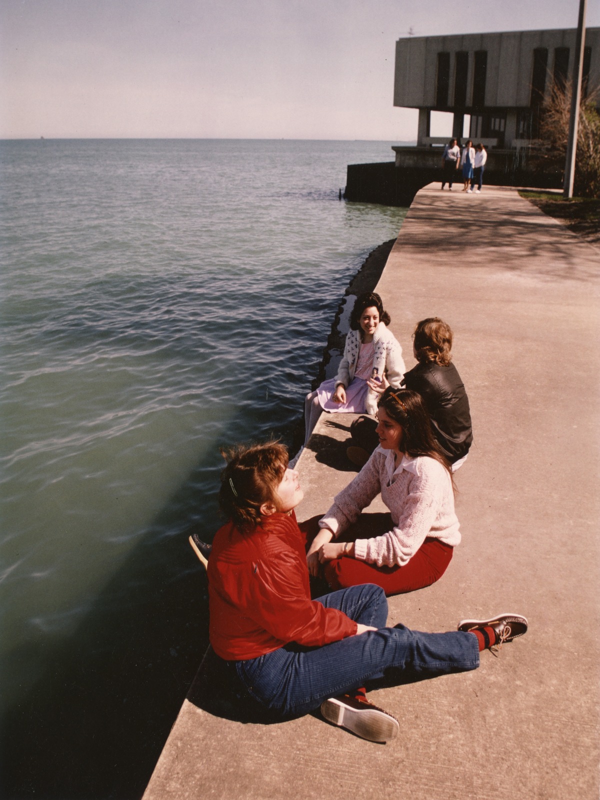 Mundelein students sitting at the edge of the Lake